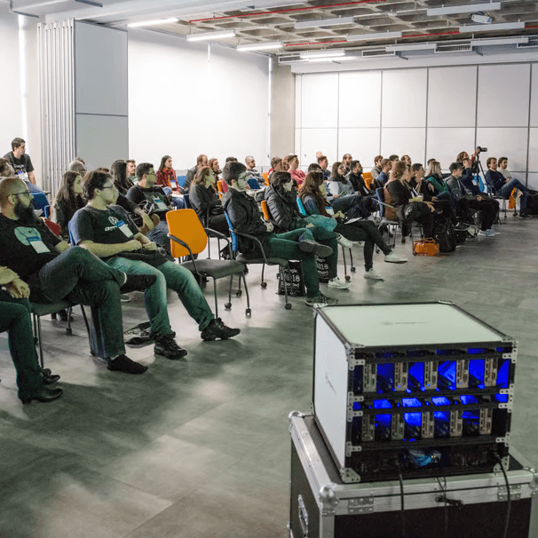 Audience at Vortex technology presentation — engaging the community with innovation